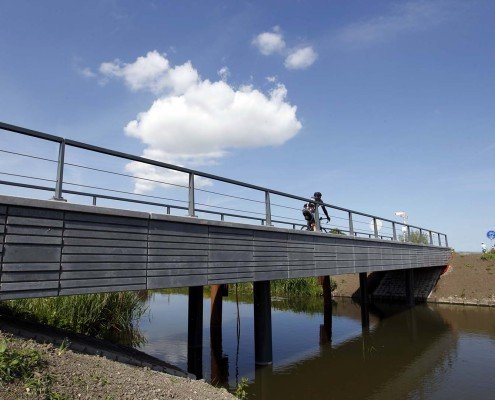 verkeersbrug, Kralingerpad Maasland, fiets en voetgangersbrug, karakteristieke gemetselde randen, brugontwerp ipv Delft